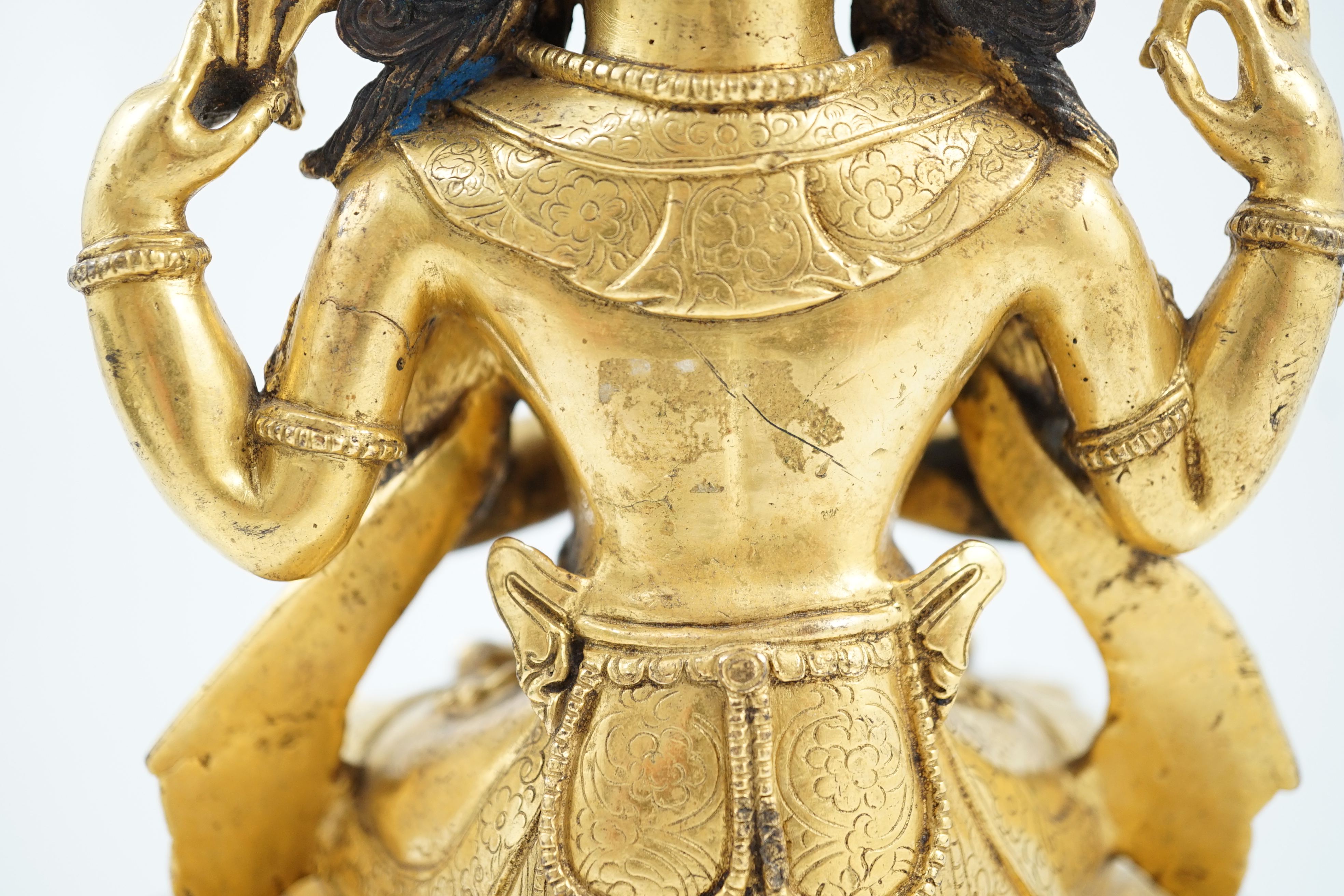 A Sino-Tibetan gilt bronze figure of Shadakshari Lokeshvara, possibly 18th century